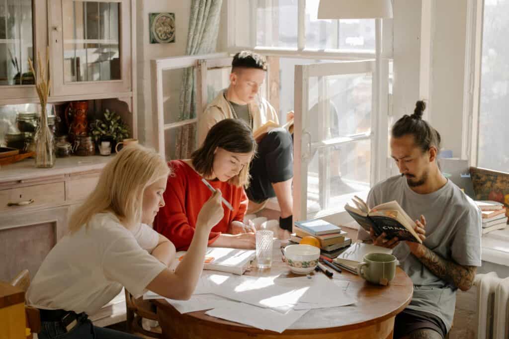 College students studying together in an apartment