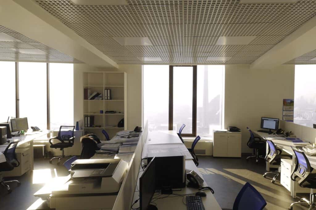 A spacious office full of furniture and equipment